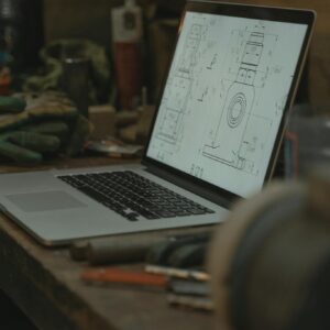 Macbook Pro on Brown Wooden Table