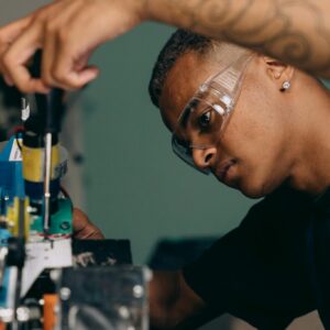Man in Black Shirt Holding Black Screwdriver